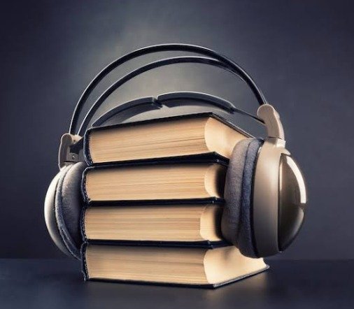 Headphones resting on a stack of books